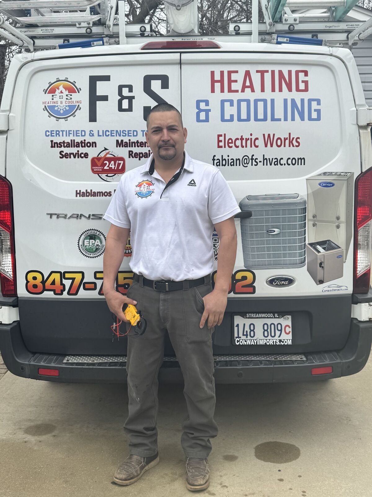 Fabian Ortega, owner of F&S Heating & Cooling, in front of his service van