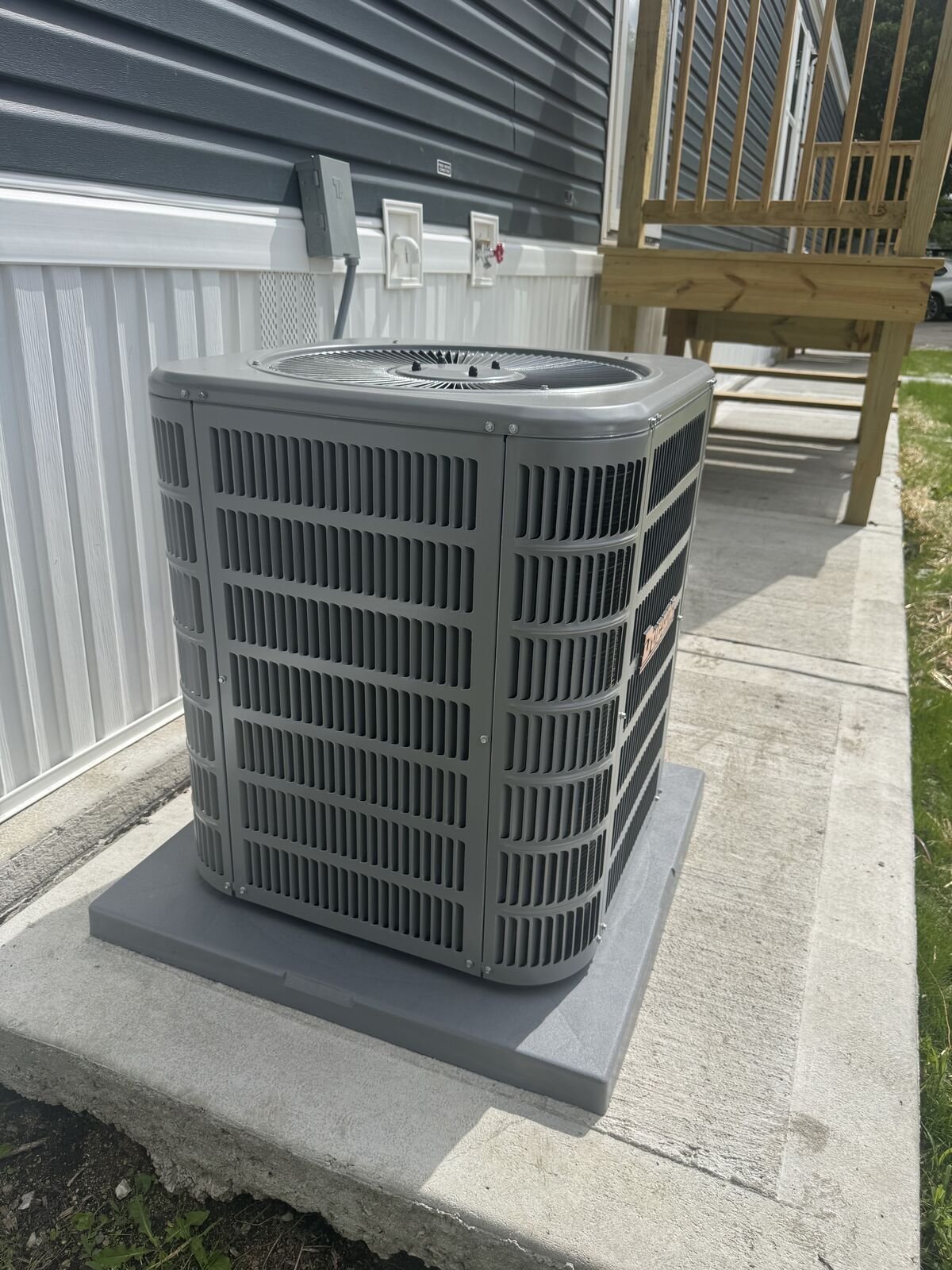 New Ducane air conditioner installed on pad