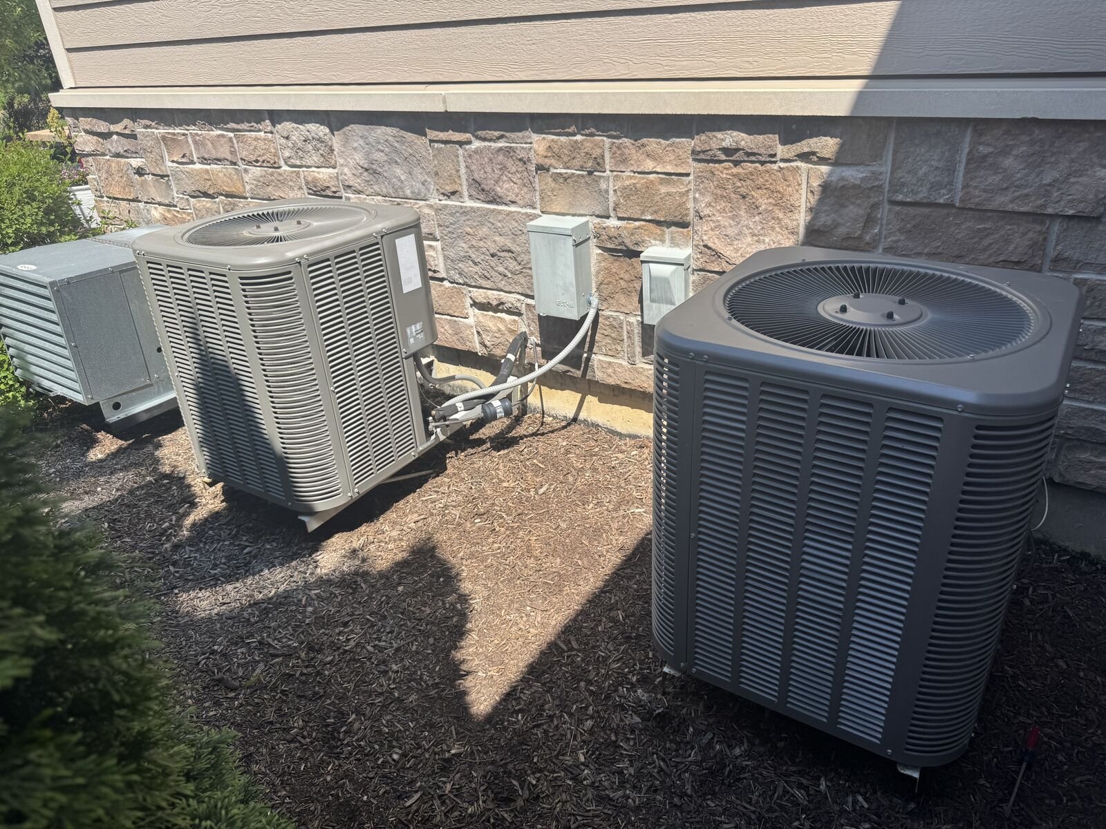 New condenser next to older unit